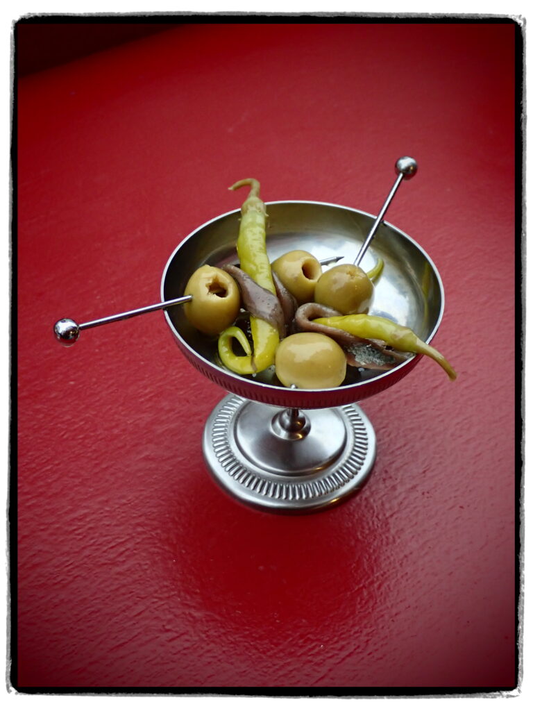 detail shot of cocktail with Spanish specialities