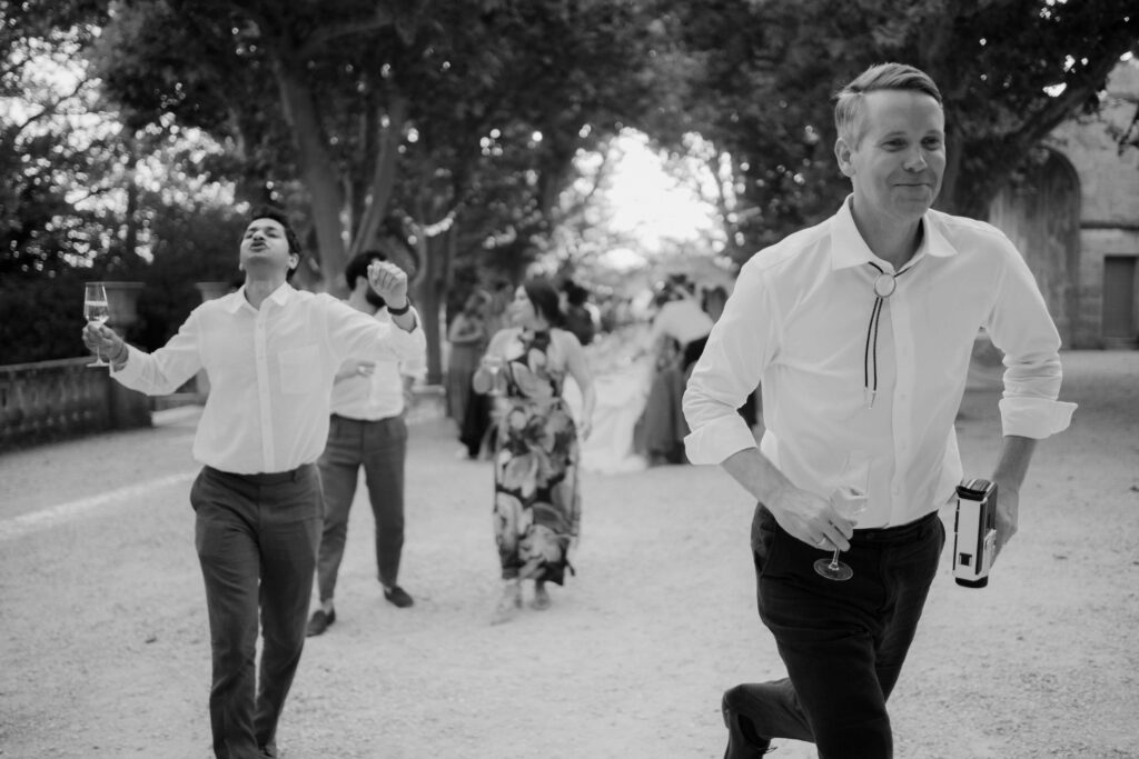 guests running to the new place for the party outside after dinner