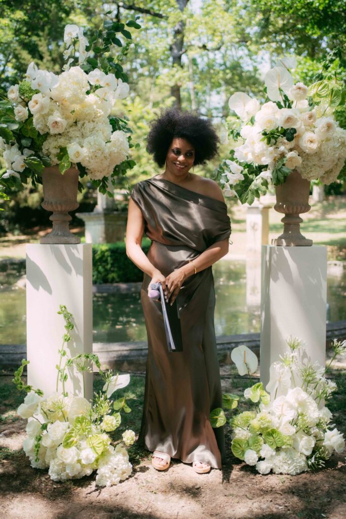 officiant juste before the ceremony of the couple in the garden