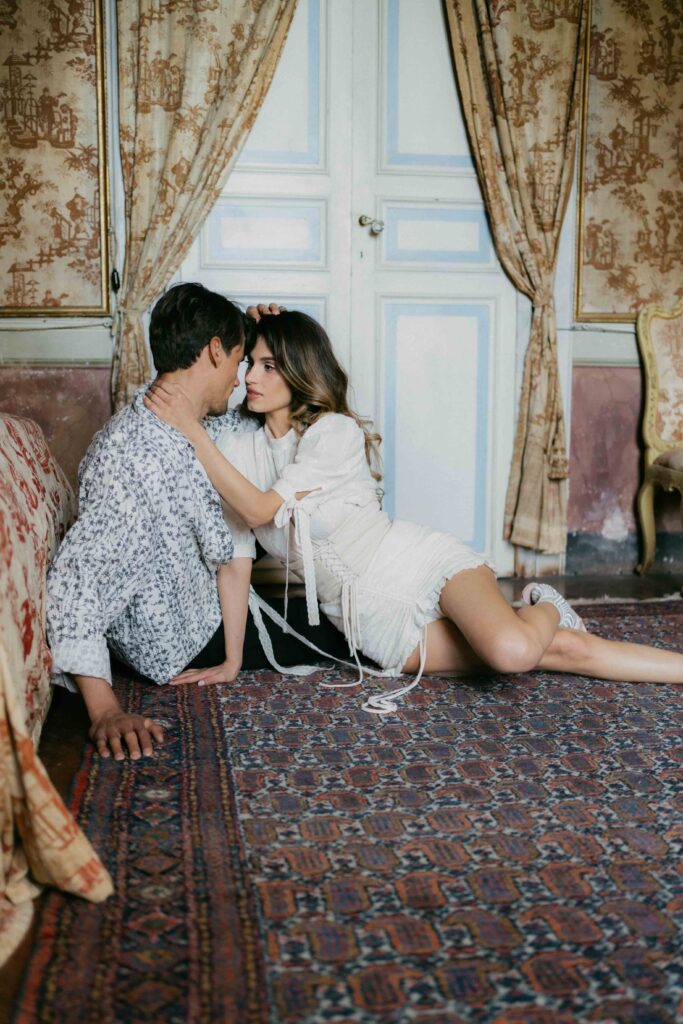 couple cuddling before wedding